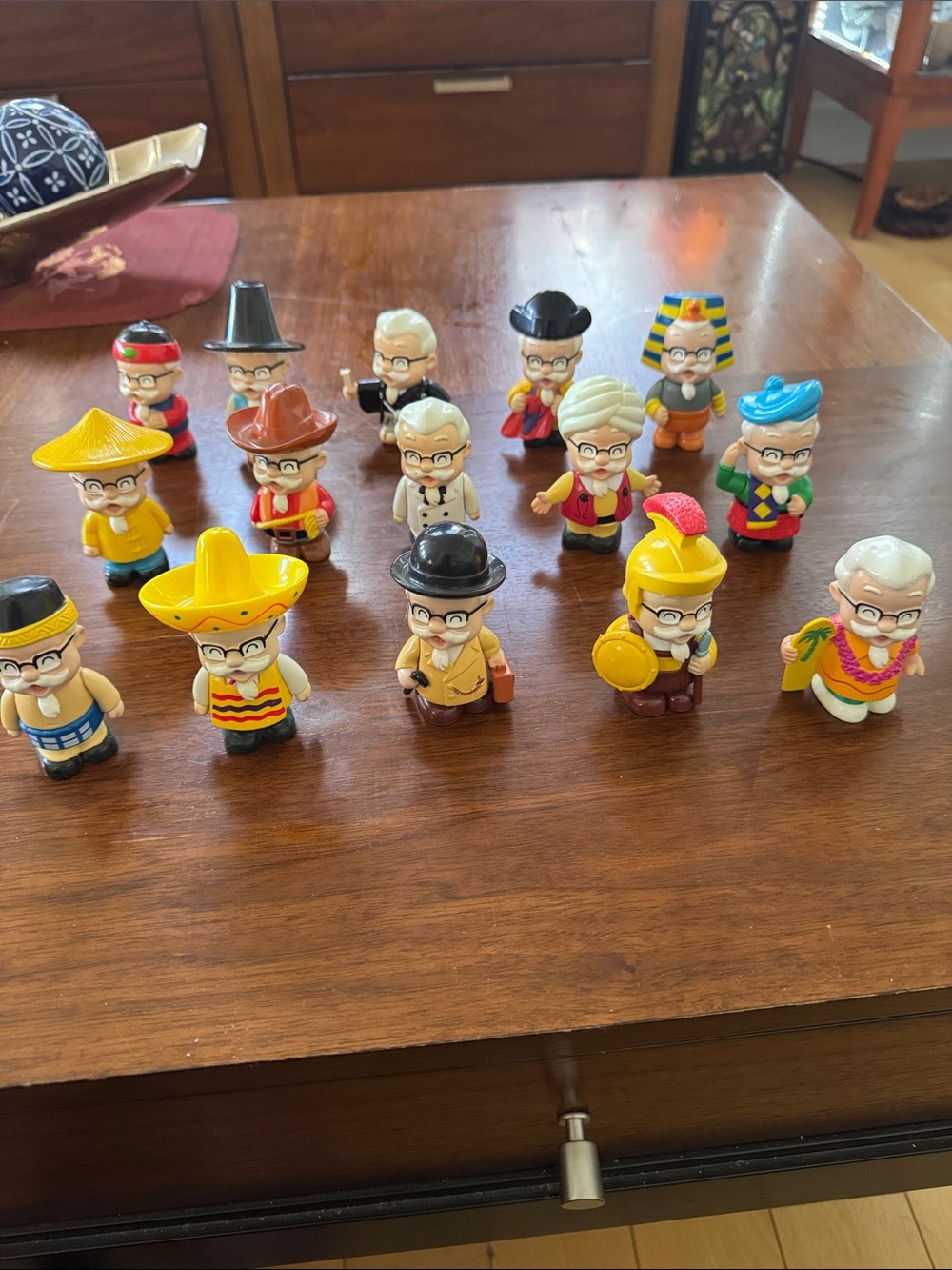 A set of 15 Collectable KFC Colonel Sanders “Around the World” vinyl figures
